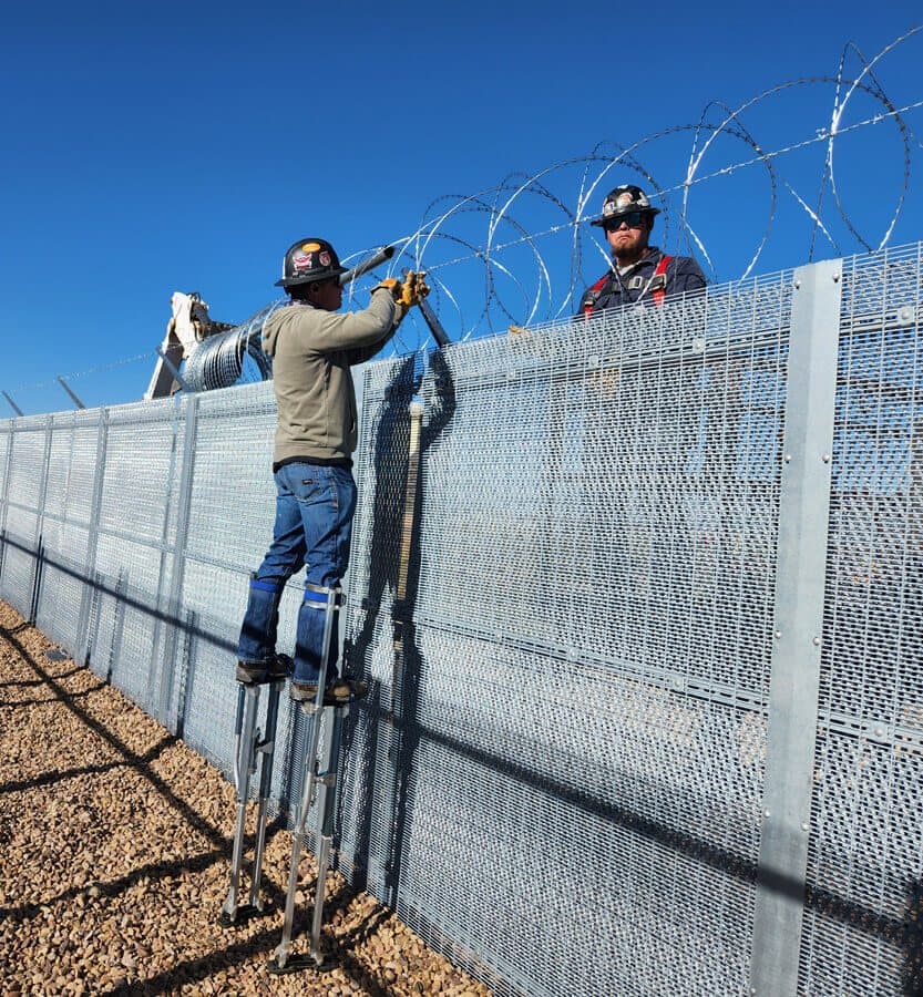 SWi Fence team installing a commercial security fence