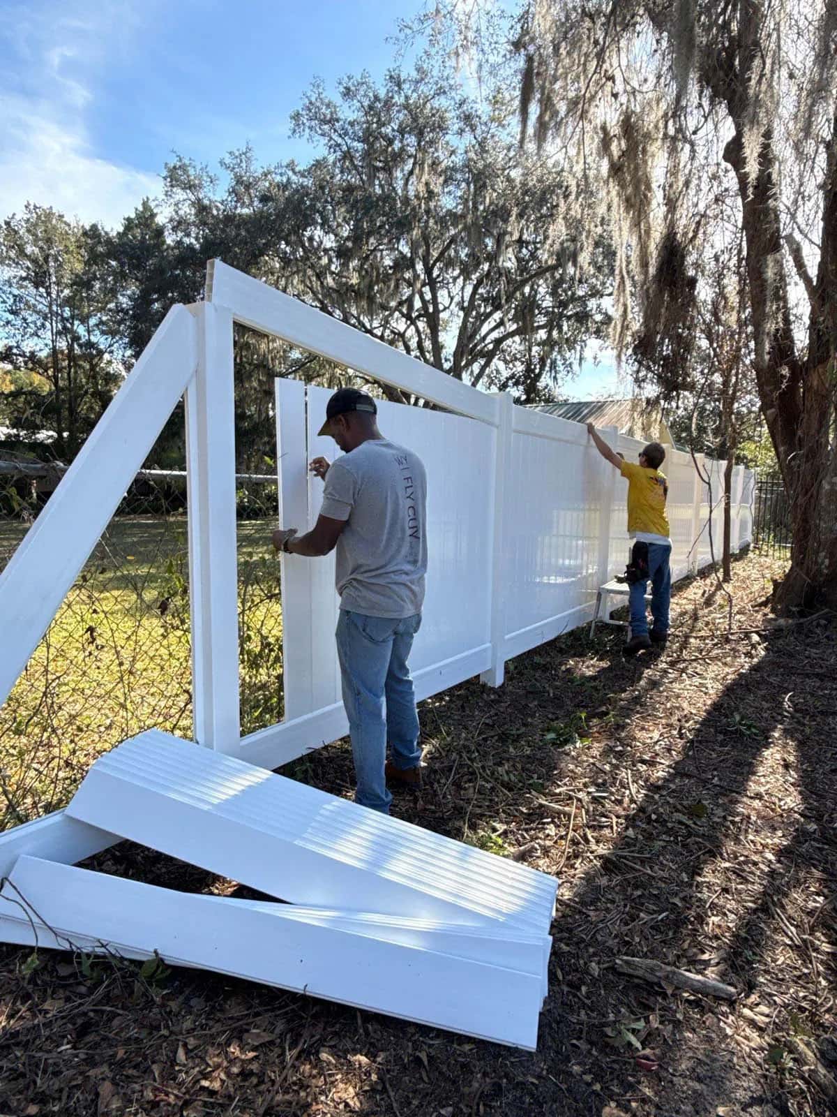 SWi Florida Crew Members Installing Vinyl Fence