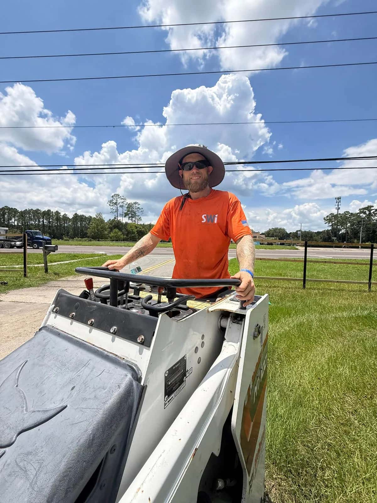 Swi Fence Florida Crew Member Installing Fence Driving Bobcat Mt100